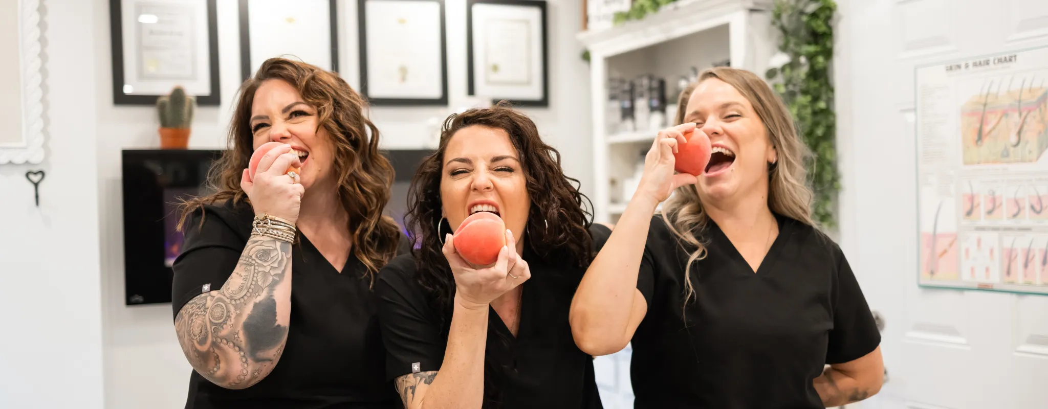 3 of us taking a bite of a fuzzy peach 