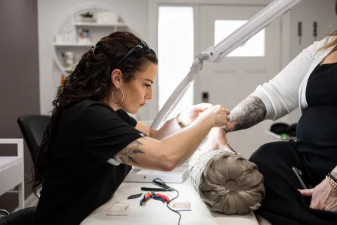  Brooke placing a permanent jewelery bracelet